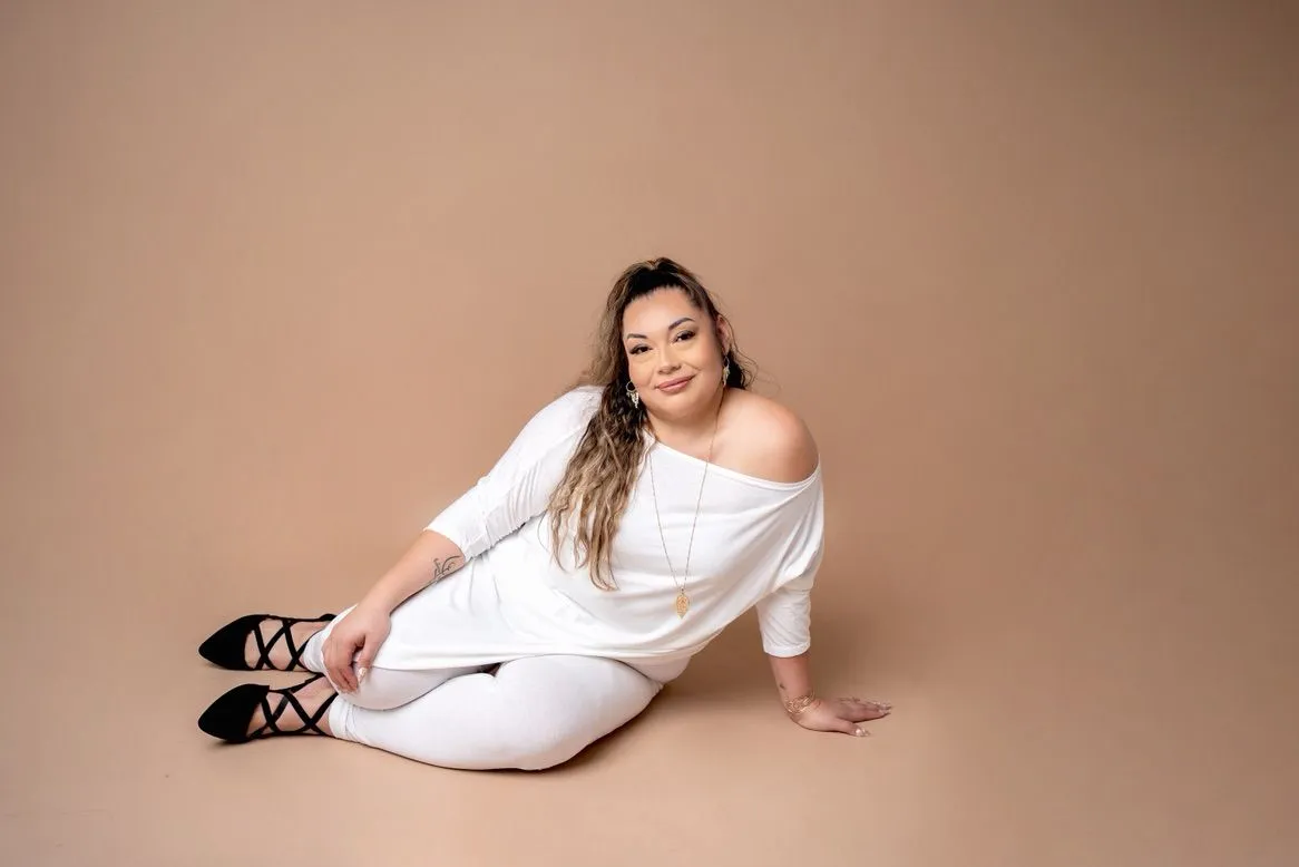 Lorena, founder of LashOutlolo & esthetics, seated for a portrait