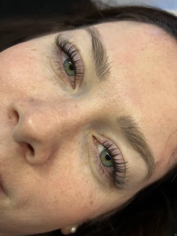 Close-up of a glossy wet and anime-inspired lash set